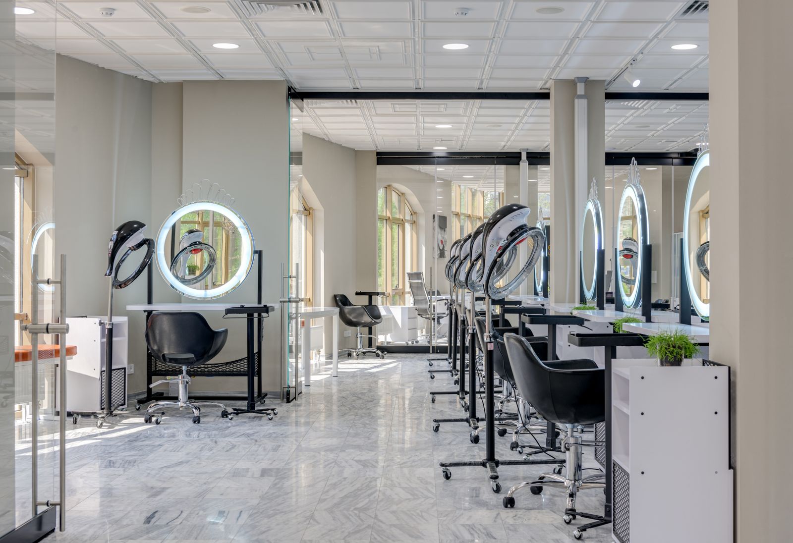 Bright salon with mirrors and styling chairs