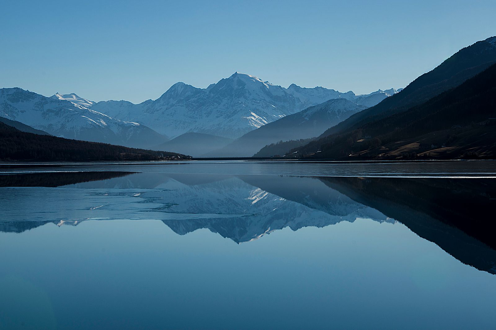 Mountain peaks reflected in a still lake